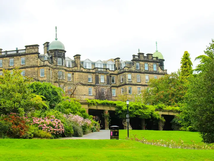 Victorian stone buildings above flowering gardens in Harrogate